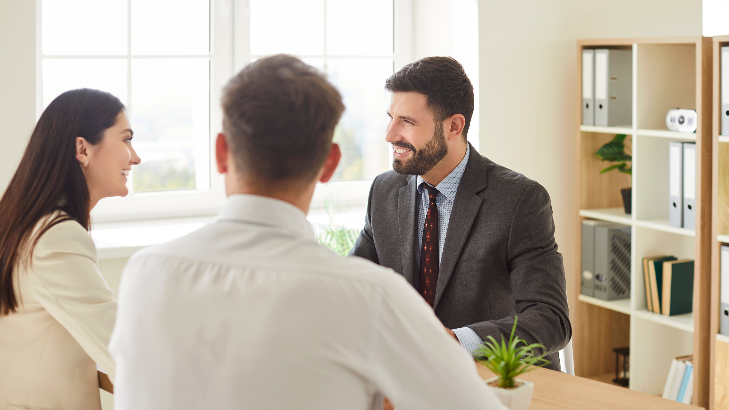 Mortgage agent meeting with clients in a Toronto office